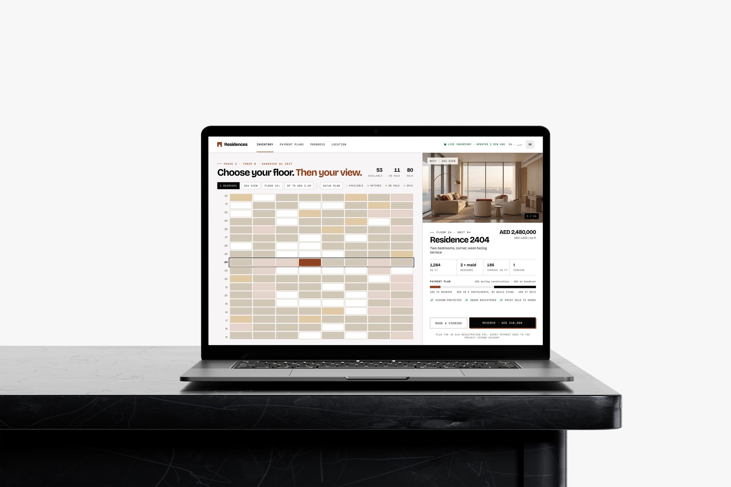Concept screen on a laptop: live inventory for an unbranded Dubai tower, floor 24 selected, unit 2404 with its price, payment plan and a reserve button.